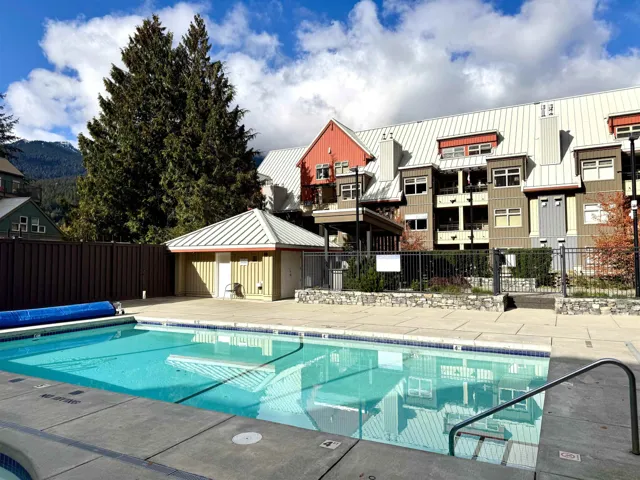 Community pool with a patio