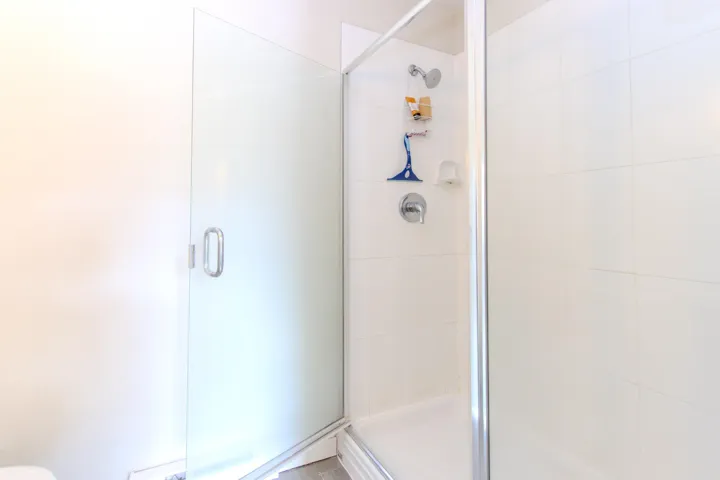 Full bath with a shower stall
