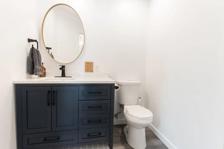 Bathroom with vanity and wood finished floors
