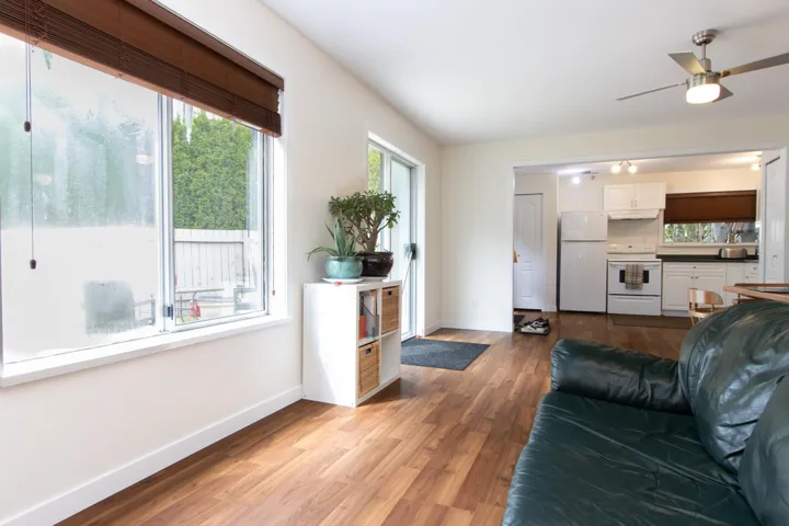 Living room featuring wood finished floors and ceiling fan