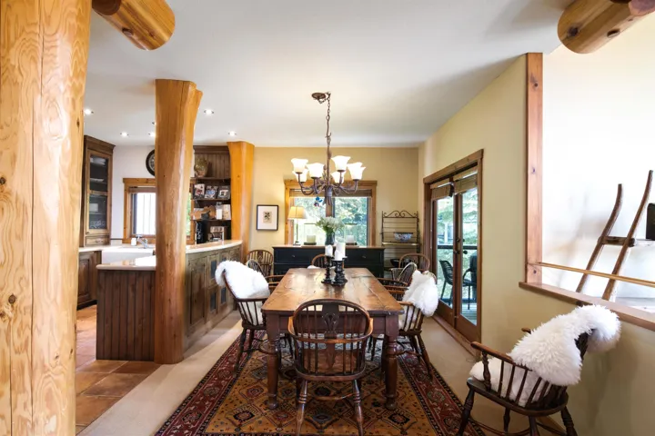 Dining room with recessed lighting, french doors, and a chandelier