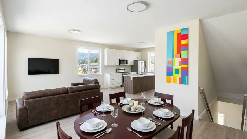Open-concept living space with wood-finish flooring