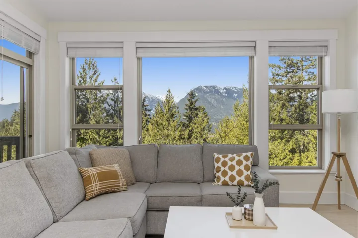 Large windows with mountain and tree scenery