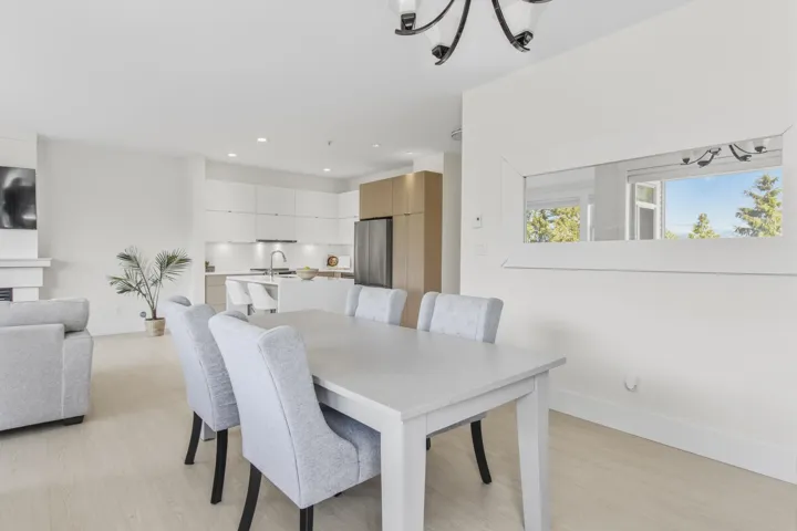 Open-concept living area featuring light wood-finish flooring