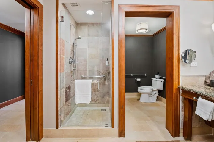 Bathroom featuring a shower stall, crown molding, recessed lighting, and vanity