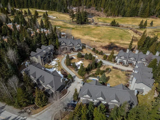 Drone / aerial view featuring a residential view and a wooded view