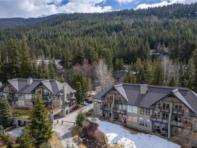 Birds eye view of property with a view of trees