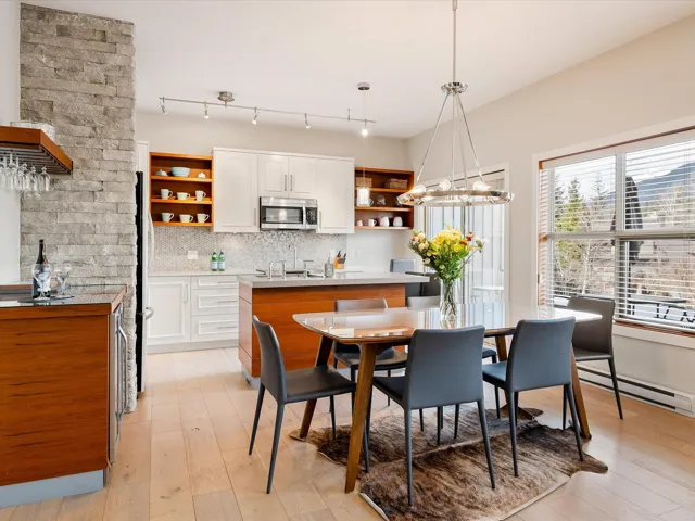 Dining room with light wood-style flooring and baseboard heating