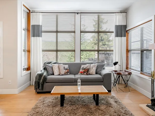 Living area with baseboards and light wood-type flooring