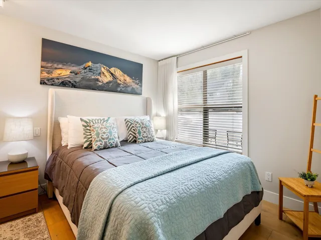 Bedroom with baseboards and wood finished floors