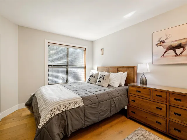 Bedroom featuring baseboards and light wood-type flooring