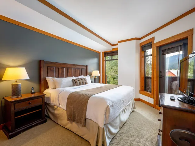 Bedroom featuring light carpet and ornamental molding