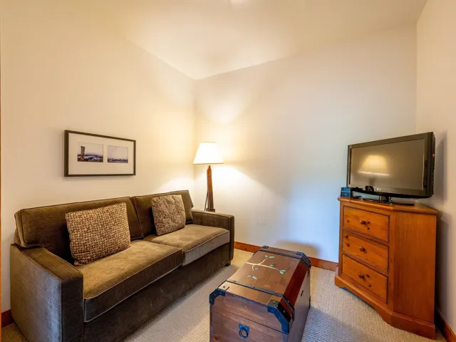 Living room featuring baseboards and carpet floors