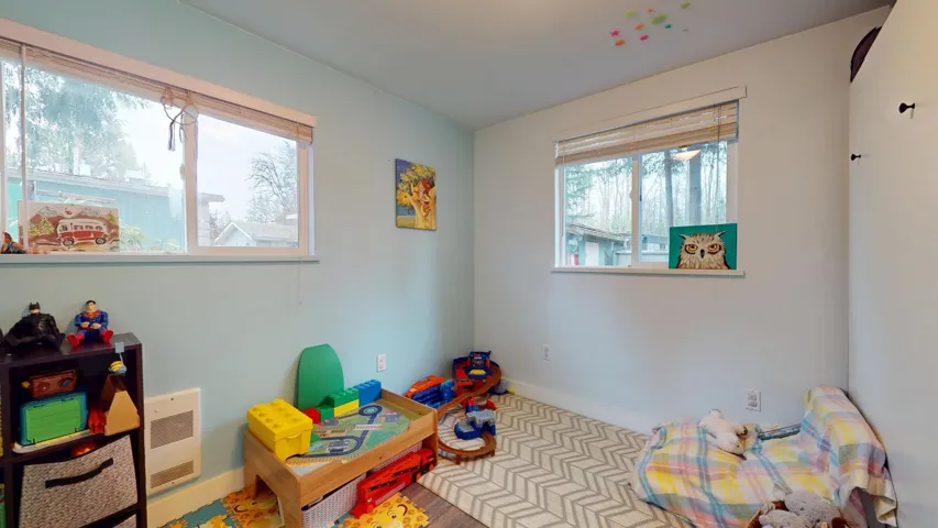 Recreation room with heating unit and baseboards