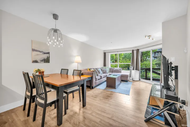 Open-concept living area with wood-finish flooring