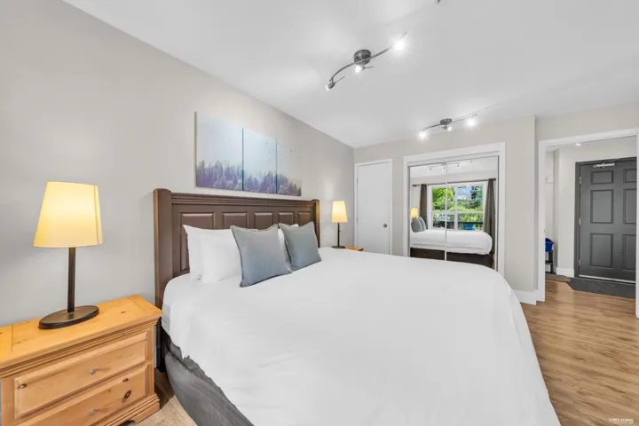 Bedroom featuring wood-finish flooring and light gray walls