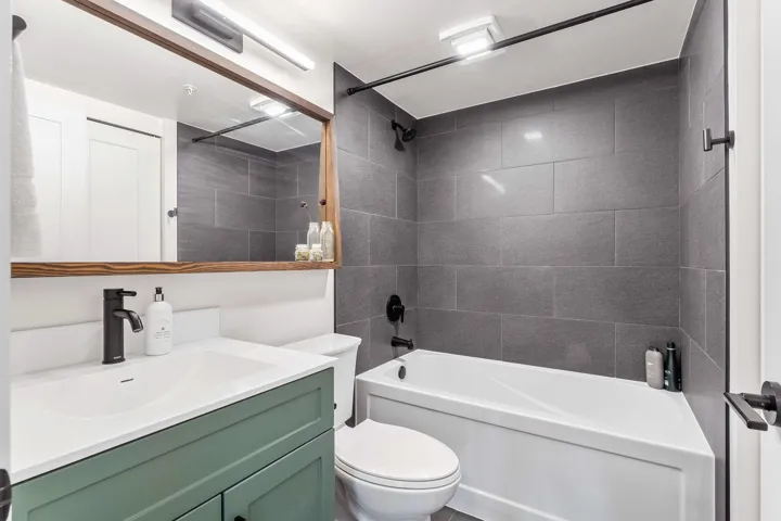 Full bath featuring vanity and tub / shower combination