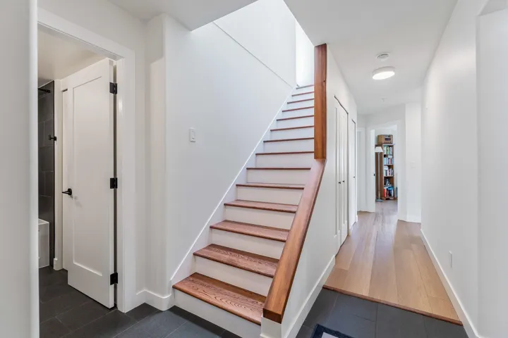 Staircase featuring baseboards