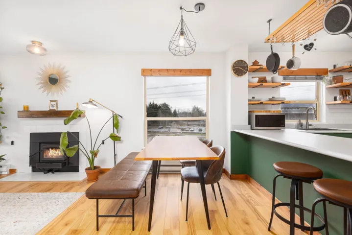 Dining room with light wood-type flooring and plenty of natural light