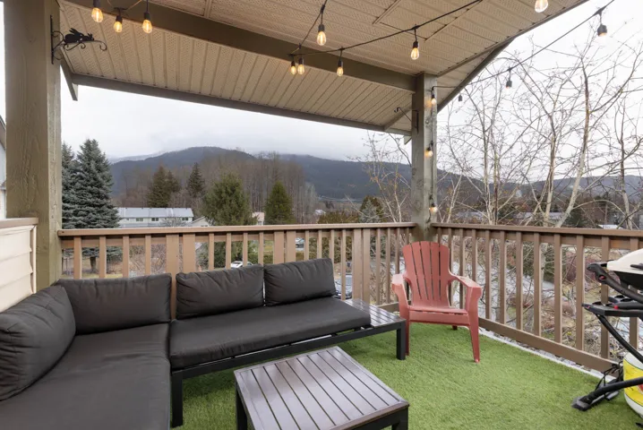 Exterior space featuring an outdoor living space and a deck with mountain view