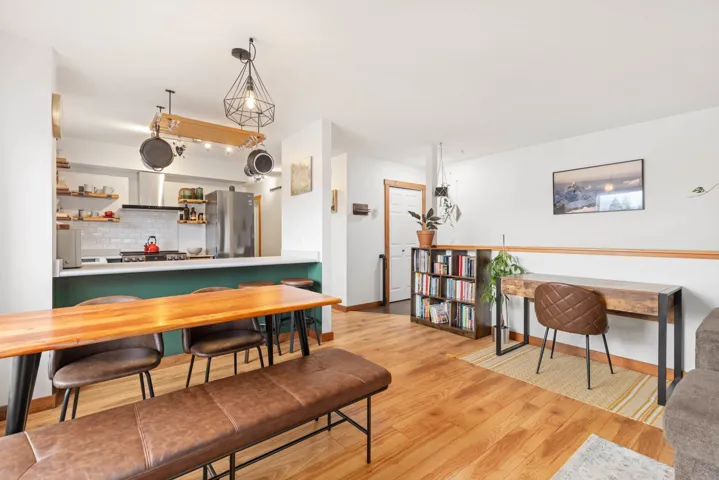 Dining space featuring baseboards and wood finished floors
