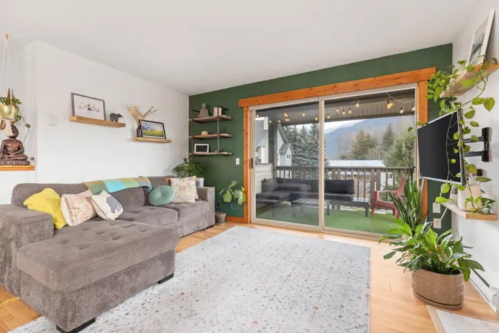 Living room featuring wood finished floors and a mountain view