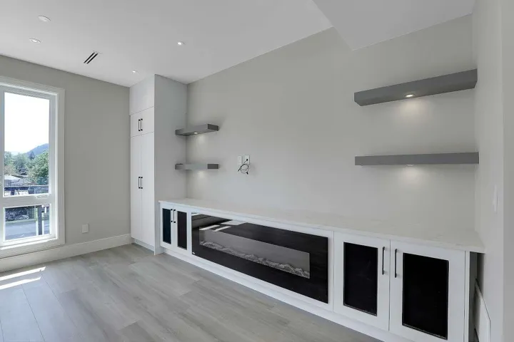 Mudroom featuring light wood-style floors and baseboards