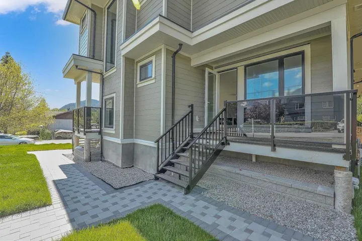 View of exterior entry with covered porch