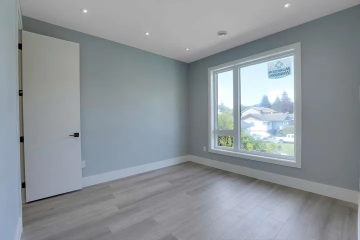 Spare room with baseboards, light wood finished floors, recessed lighting, and a smoke detector