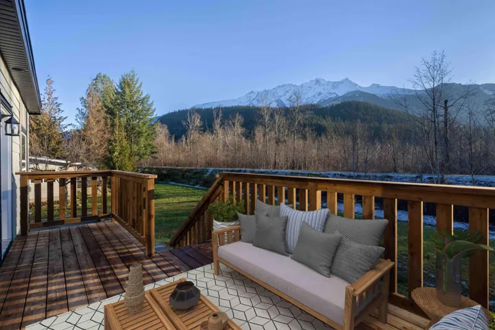 Outdoor living space with mountain view. Photo has been virtually staged.