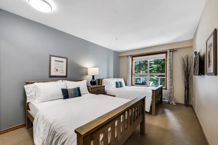 Bedroom featuring carpet floors and baseboards