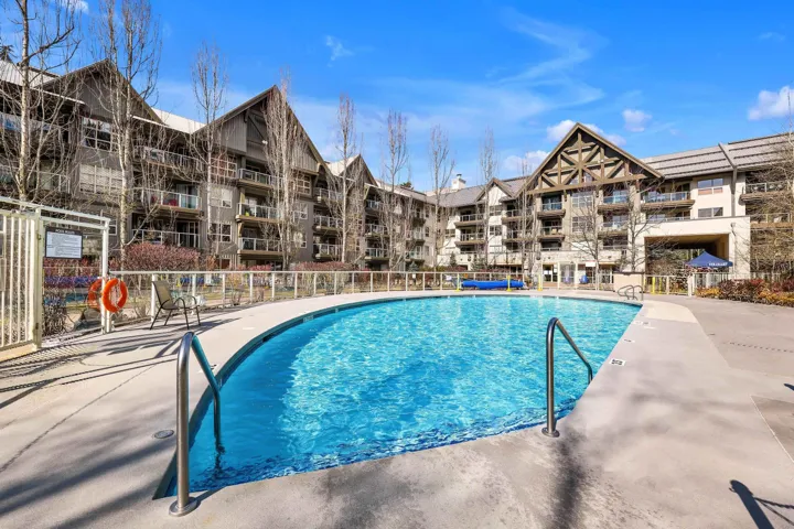Community pool featuring a patio