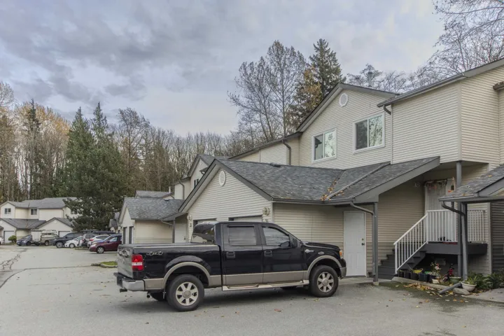 View of home's exterior with a shingled roof