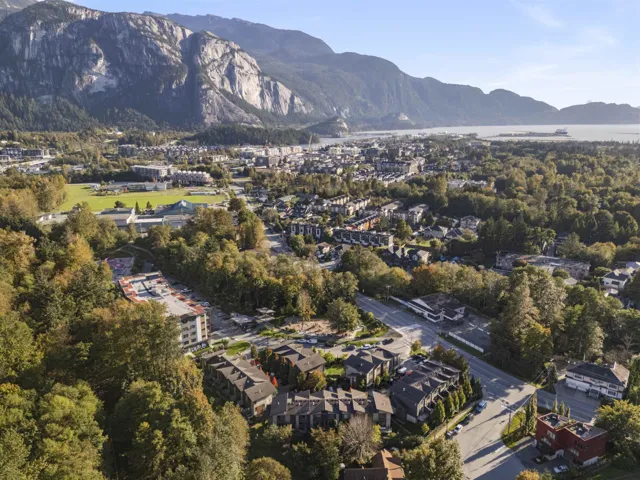 Aerial view of property's location with a mountain backdrop