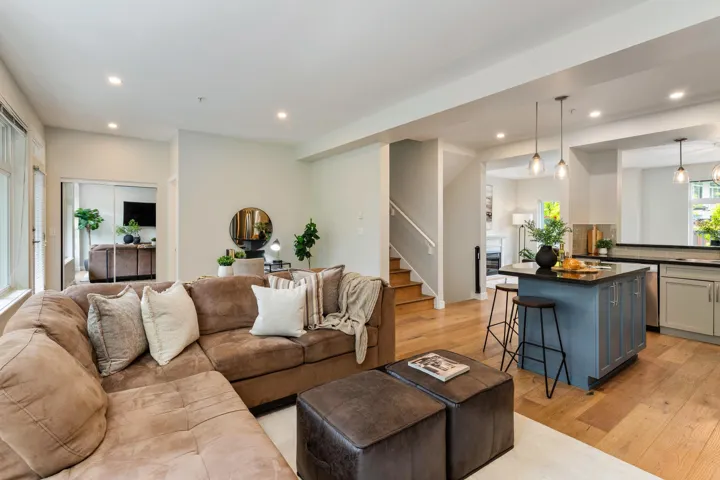 Living area featuring stairs, recessed lighting, and light wood-type flooring