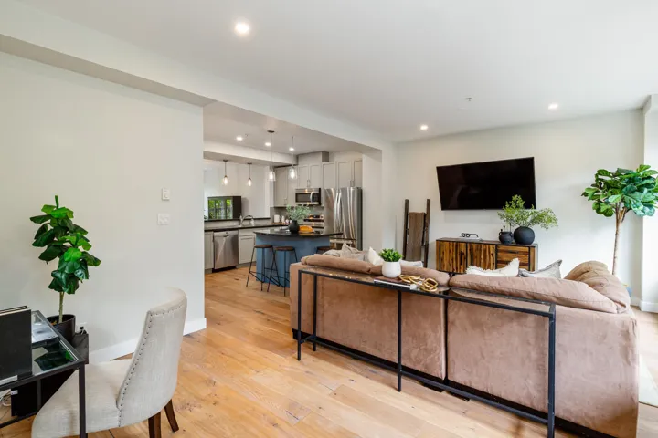 Living room featuring recessed lighting, light wood-style flooring, and baseboards