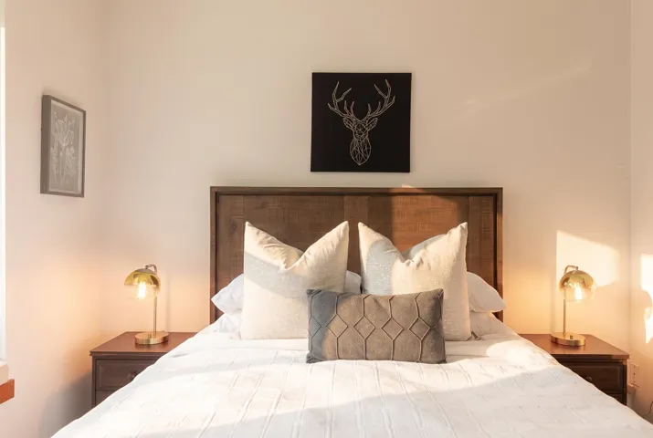 Wood-finish headboard with integrated side tables