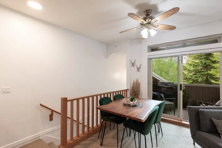 Indoor-outdoor living space featuring a sliding glass door to an outdoor balcony