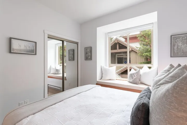 Built-in window seat with a wood-finish base and large picture window