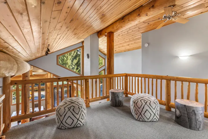 Sitting room with carpet floors, ceiling fan, and wood ceiling