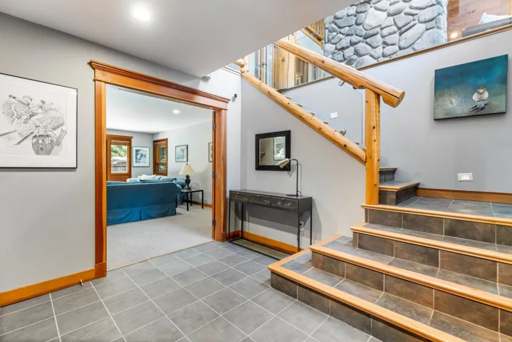 Staircase featuring tile patterned floors and recessed lighting