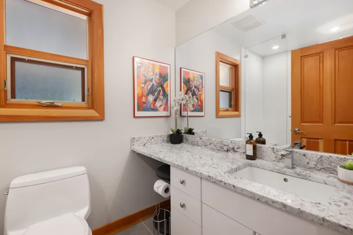 Bathroom featuring vanity and toilet