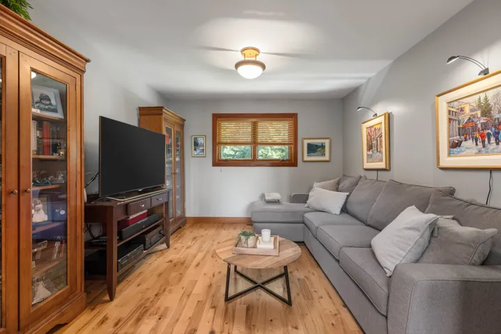 Living room featuring light wood finished floors and baseboards
