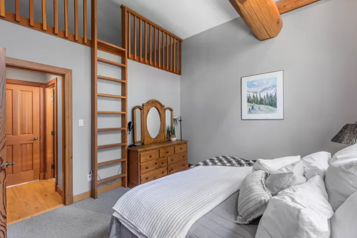 Bedroom with carpet and baseboards