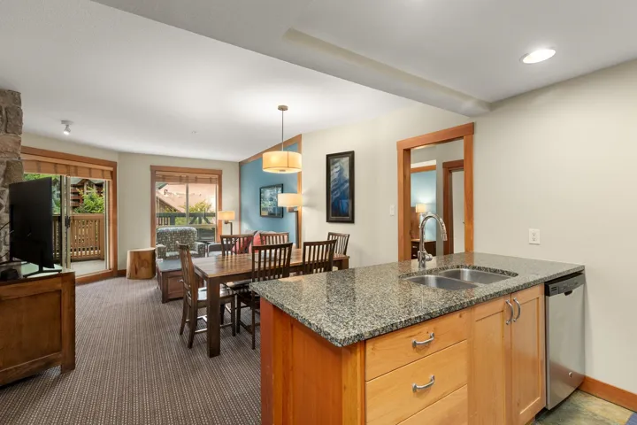 Kitchen island with granite countertop and stainless steel sink