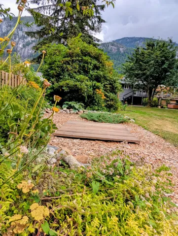View of property's community featuring a deck with mountain view