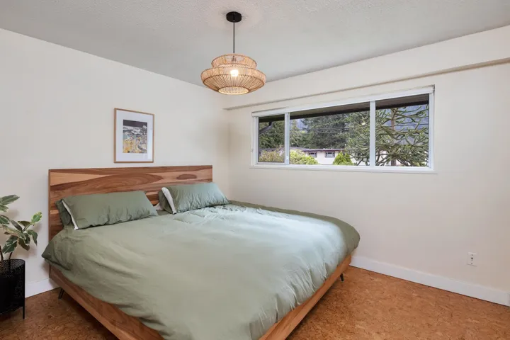 Bedroom featuring baseboards and a textured ceiling