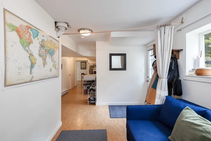 Living room with baseboards and a baseboard radiator