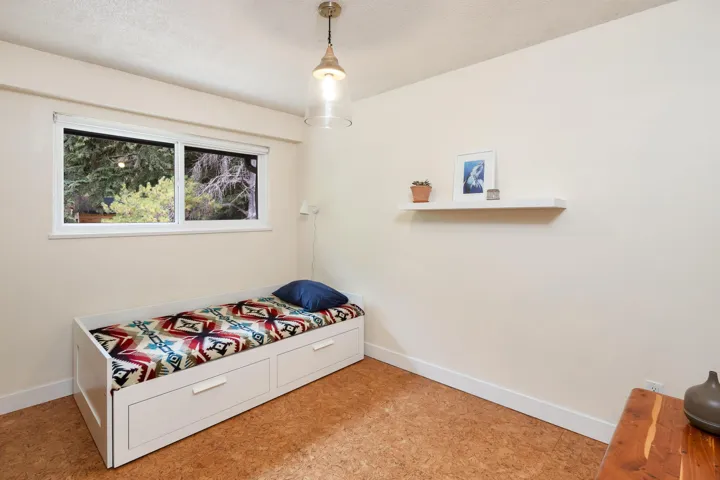 Bedroom with baseboards and a textured ceiling
