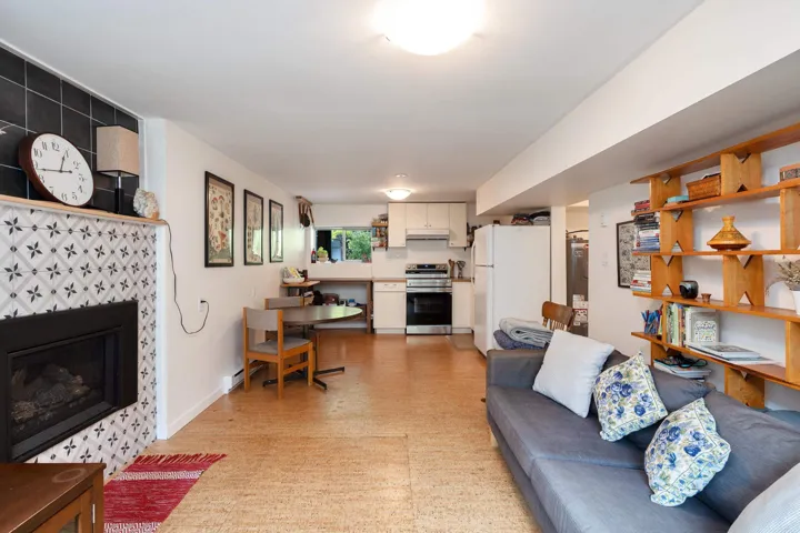 Living area featuring light floors and a fireplace